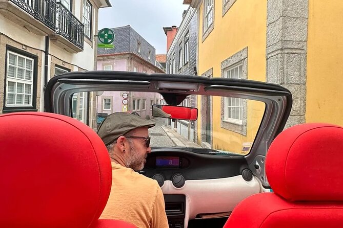 Discovering Porto in an eco-friendly vehicle - Passing Livraria Lello Without a Full Stop