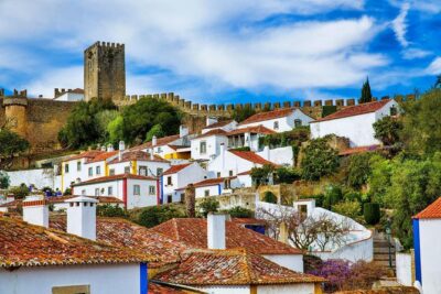Fátima Sanctuary, Óbidos Medieval and Nazaré from Lisbon - Nazaré’s Atlantic cliff views and fishing-town textures from Sítio
