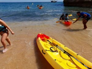 From Benagil: Benagil Caves Kayak Tour - Meeting at Benagil Beach: The Yellow Umbrella Trick