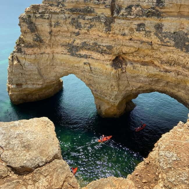 From Faro: Adventure Express Tour - Cliff Jump & Beach - Marinha Beach: guided stops, free time, and real swim views