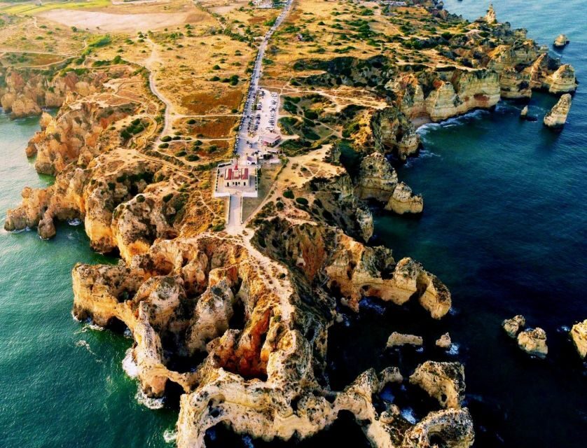 From Lagos: 2.5-Hour Guided Coastal Boat Tour & Grotto Visit - On-board comfort: shade, WC, music, and bar service