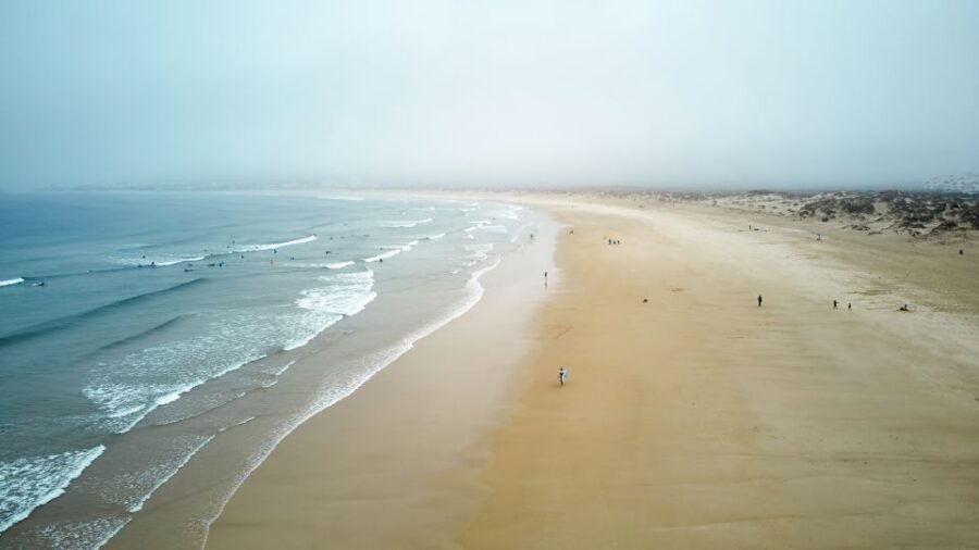 From Lisbon: Fatima, Nazare, and Obidos 8-People Group Tour - Nazaré: Atlantic surf views, lighthouse angle, and coastal photo stops