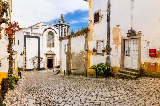 From Lisbon : Óbidos & Nazaré Giant Waves, Ginja & Small Group - Farol de Nazaré: the red lighthouse + Fort São Miguel Arcanjo views