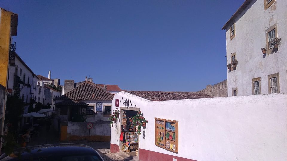 From Lisbon: Private Óbidos and Nazaré Tour - Óbidos medieval walls and the maze you’ll actually enjoy
