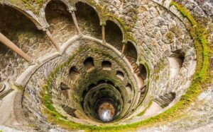 From Lisbon: Sintra, Pena Palace and Regaleira Day Trip - Quinta da Regaleira: wells, tunnels, and the kind of story you can walk through
