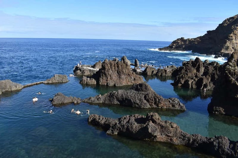 Funchal: Waterfalls, Volcanic Pools, and Fanal Forest Tour - Porto Moniz lava rock pool and the best swim time of the day