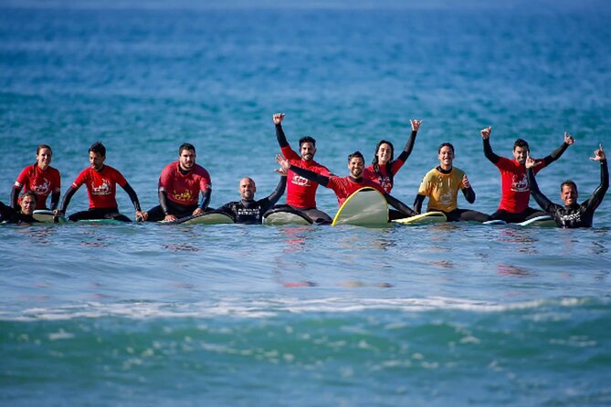 Group Surf Lessons - Level-based coaching: from first stand to riding waves