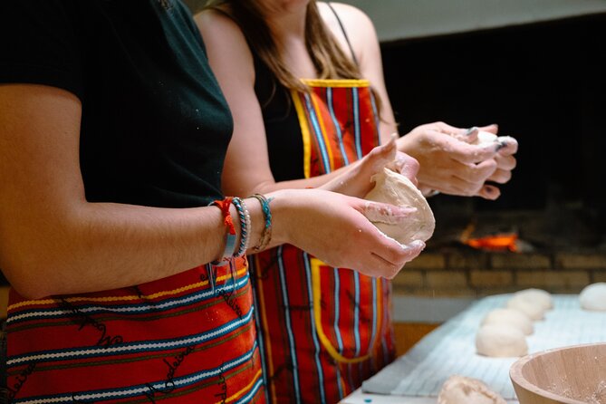 Hands-On Bolo do Caco Baking Class with a Madeiran Family - The mountain backdrop and the table moment