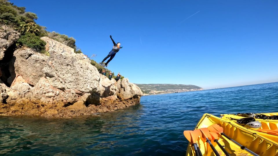 Lisbon: Arrábida Kayak and Coasteering Adventure Tour - Kayak time at Portinho da Arrábida: limestone coast, cliffside beaches, and cave stops