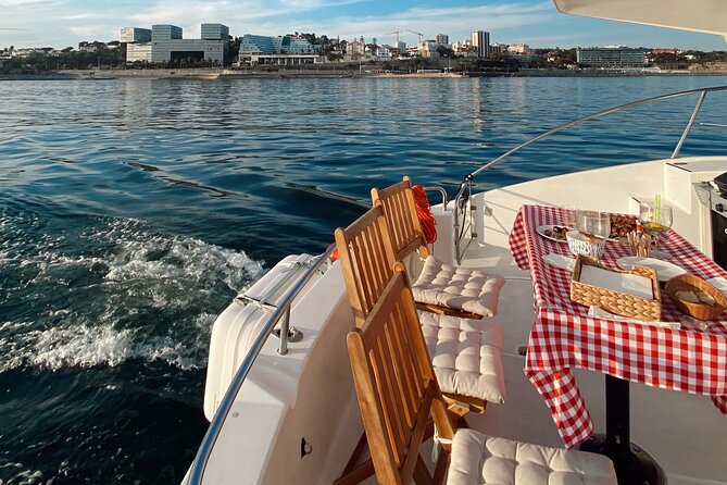 Lisbon: Catamaran Luxury Sunset and Wine Tour - Crossing toward Praça do Comércio and beyond: Lisbon from multiple angles