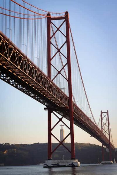 Lisbon: Exclusive Golden Hour Sunset Boat Cruise - 25 de Abril Bridge: the Lisbon icon that photographs like a postcard