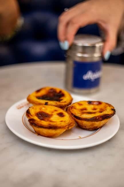 Lisbon: Food Tasting Tour by Tuk Tuk with 2 Stops - Tuk-Tuk Comfort and Street Reality (Bumpy Is Possible)