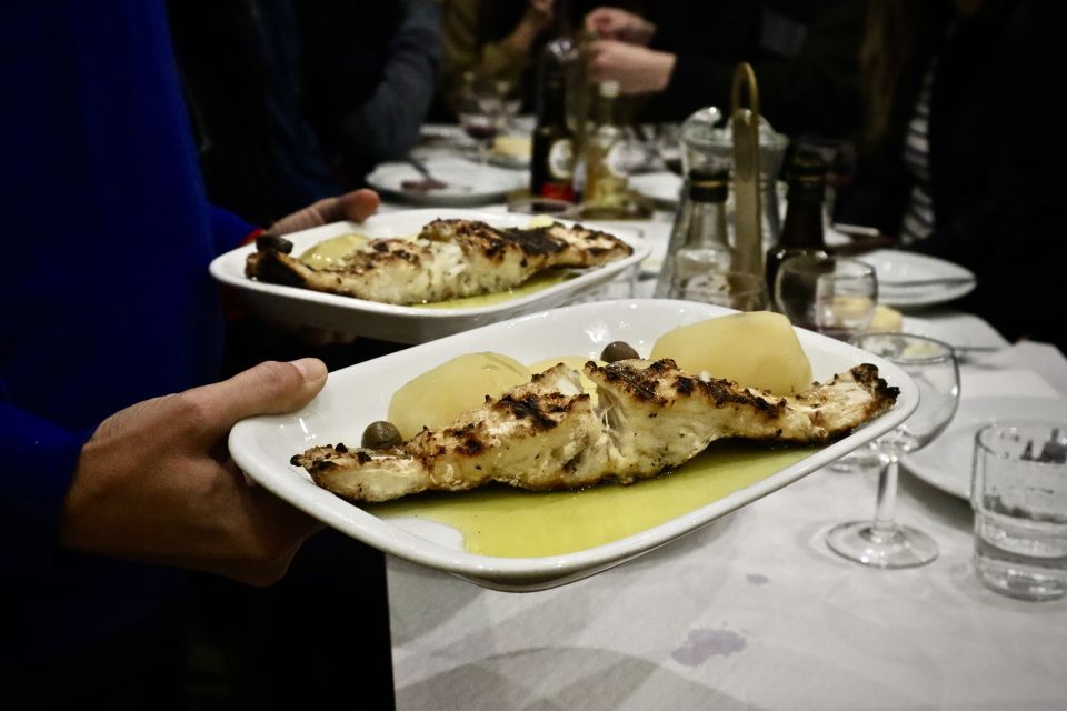Lisbon Food Tour: 10+ Tastings of Local Delicacies & Wines - Meeting José Saramago Foundation: the orange umbrella starts the fun