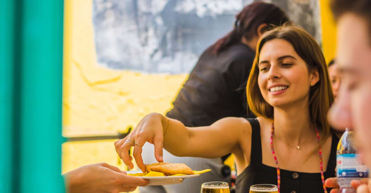 Lisbon: Guided Food and Wine Tasting Tour - Mouraria guided time: street art and Fado atmosphere in the same breath