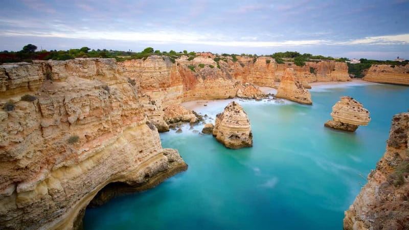 Lisbon: Private Algarve & Benagil Cave Full-Day Coastal Tour - Praia da Marinha: white-sand vibes and Seven Hanging Valleys time