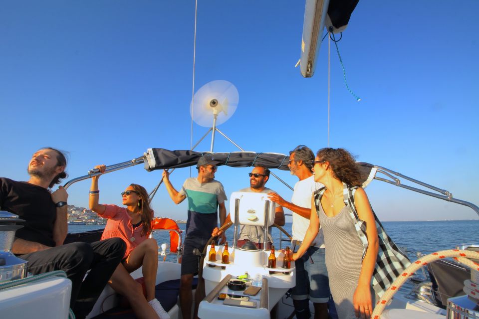 Lisbon: Sailing Tour with Wine and Snacks - Under the 25 de Abril Bridge: the classic Lisbon wow