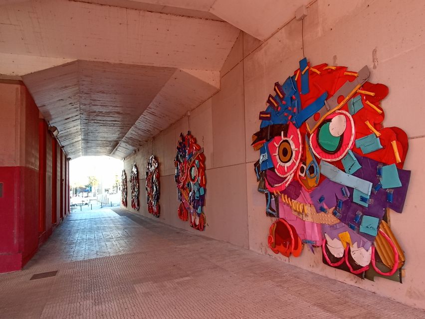 Lisbon: Street Art Tuk Tuk Tour - Art deco warehouses and the factory-city clues