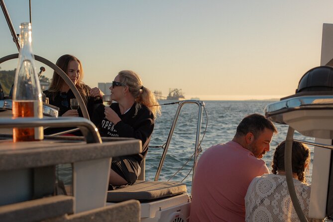 Lisbon Sunset Boat Cruise Tour With Drinks Included - What you get for about two hours: drinks, snacks, and warm blankets