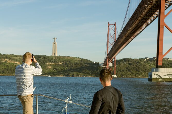 Lisbon : Sunset Catamaran Boat Tour with Music and Drinks - The Tagus route: Cristo Rei, 25 de Abril Bridge, Belém, and more