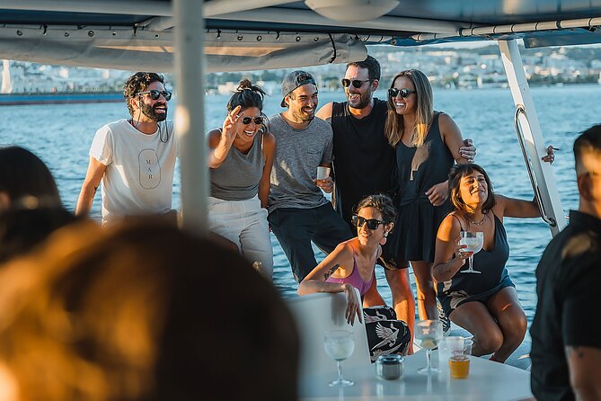 Lisbon : Sunset Catamaran Boat Tour with Music and Drinks - Music and drinks: fun energy, and what to expect from the vibe
