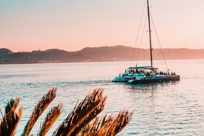 Lisbon : Sunset Catamaran Boat Tour with Music and Drinks - What’s included: welcome drink, mantas, crew, and the practical comforts