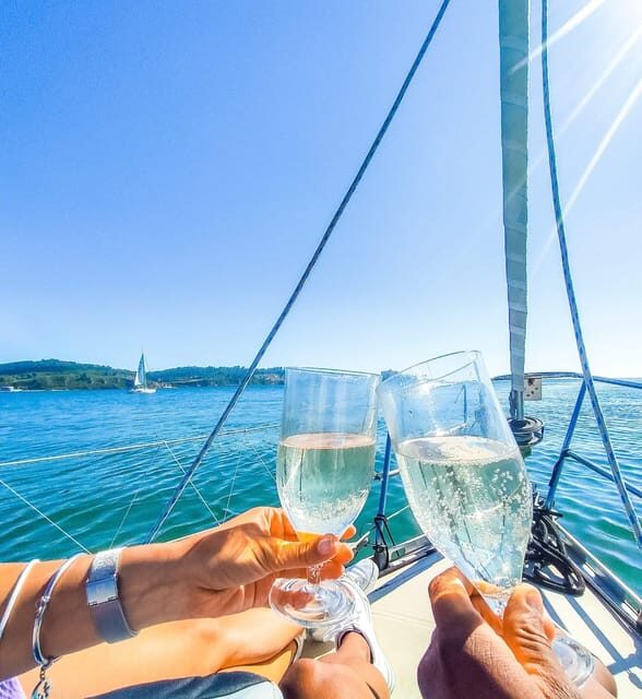 Lisbon: "Sunset" & "Day Tours" by boat, with drink and music - Tagus sunset in Lisbon: why two hours feels like the right amount