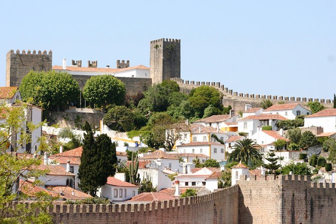 Lisbon to Porto Up To 5 Stops Óbidos Nazaré Fátima Coimbra Aveiro - Stop 2: Nazaré for ocean energy and surf legends