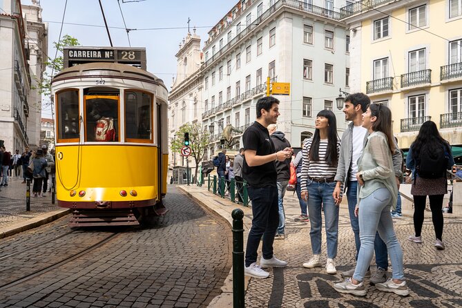 Lisbon Walking Tour: Belém Neighborhood, Tram & Boat Ride - Arriving in Belém: Torre de Belém exterior and the Age of Discoveries story