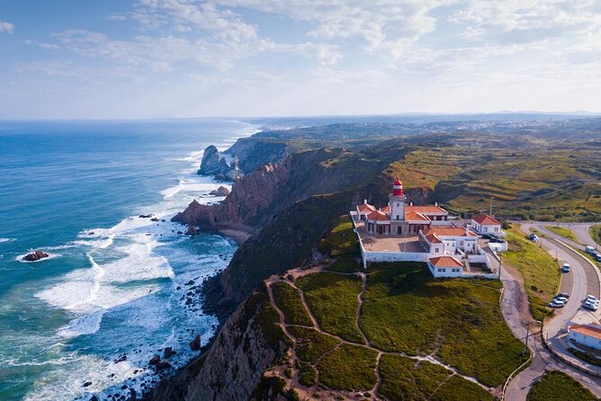 Pena Palace, Sintra, Roca Cape & Cascais on comfortable van - Quinta da Regaleira: fairy-tale tunnels, spiral well, and garden secrets