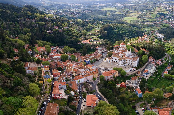 Pena Palace, Sintra, Roca Cape & Cascais on comfortable van - Small-group comfort you can feel: air-conditioning, water, and photo pull-offs