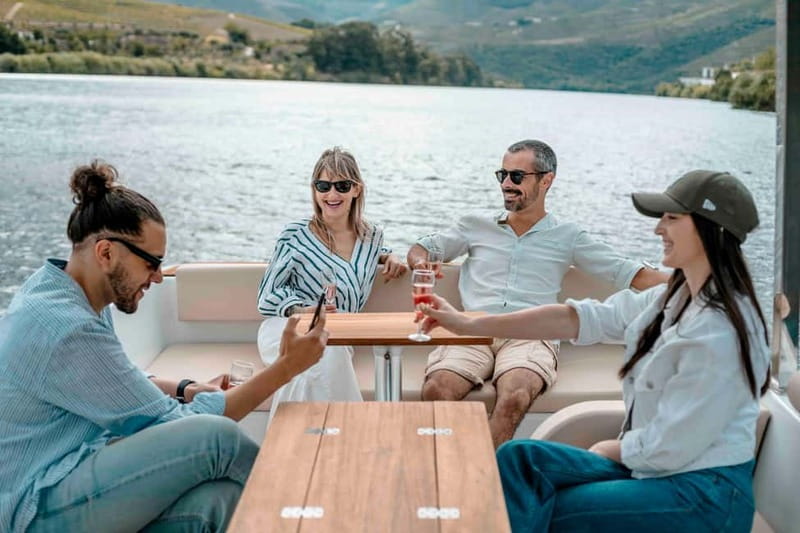 Pinhão: Douro River Solar Boat Tour with Wine Tasting - Wine tasting on board: two pours with Adega de Favaios