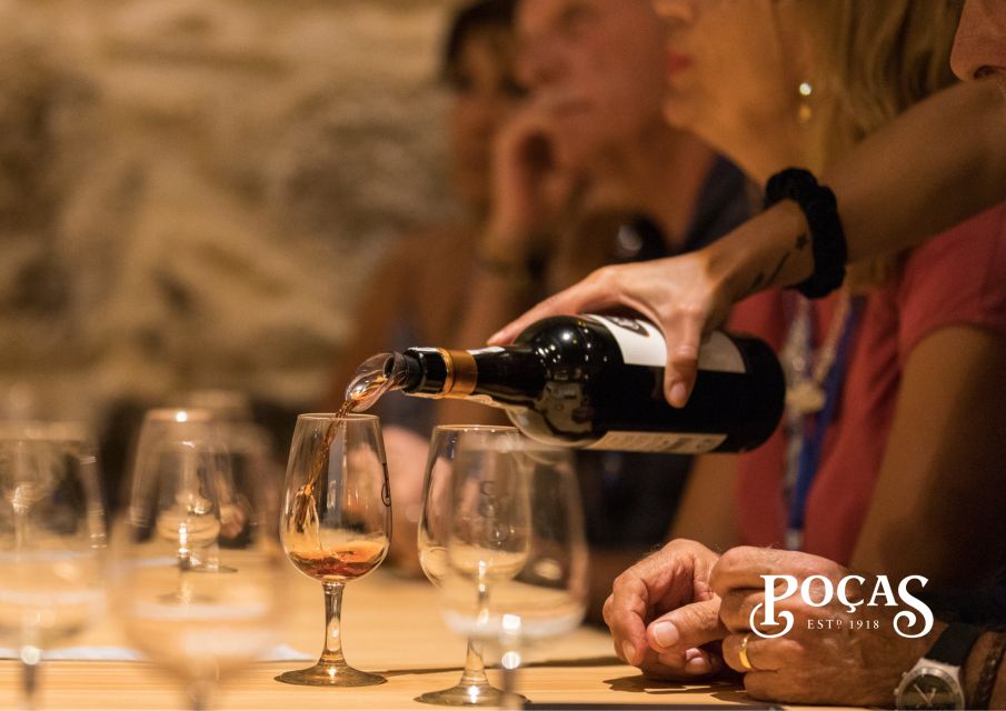 Poças: Guided Tour & Port Wine Tasting with Pastel de Nata - Inside Poças: Touring a cellar with wines aged 100+ years