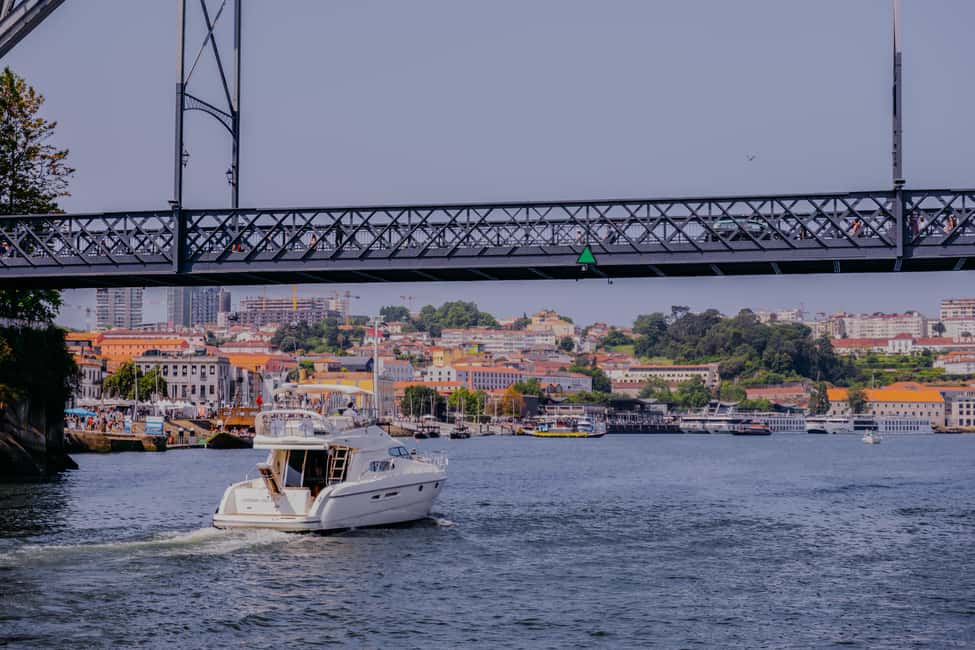 Porto: 6 Bridges Private Cruise with Local Wine and Snacks - Wine, port, cheese, cured ham, and champagne tasting: the food side of the river