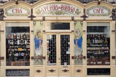 Porto Full-Day Tour with Douro River Cruise and Port Wine Tasting - Pickup, your guide, and the car route through old Porto