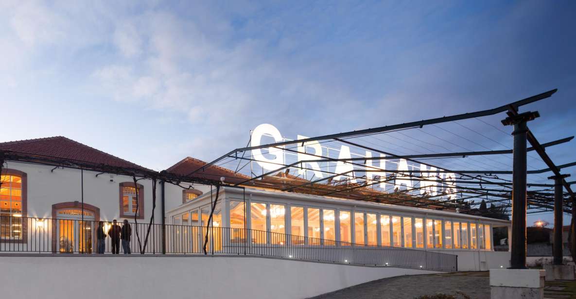 Porto: Graham's Port Lodge Tour & Vintage Room Wine Tasting - Step into the working cellar: pipes, vats, and how the place runs