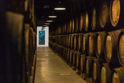 Porto: Guided Tour and Tasting of 3 Port Wines at Poças - Entering the 100+ year ageing cellar: what you’re really seeing
