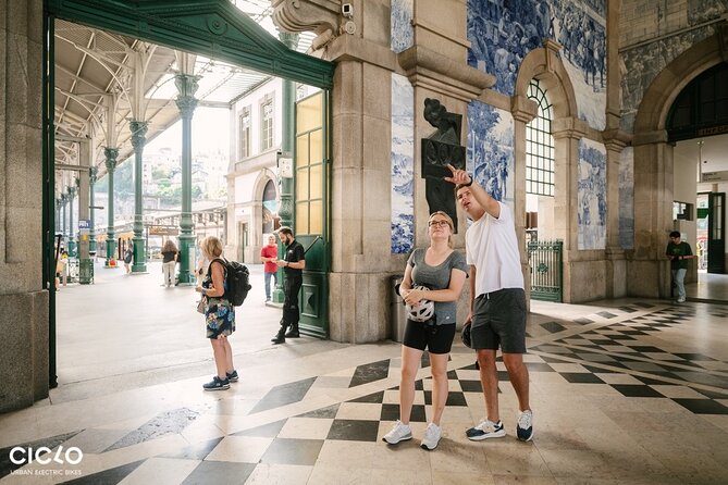 Porto Highlights in 3 Hours E-Bike Tour - Historical, Sightseeing - Clérigos Tower from outside: photos, square time, and a ticket note