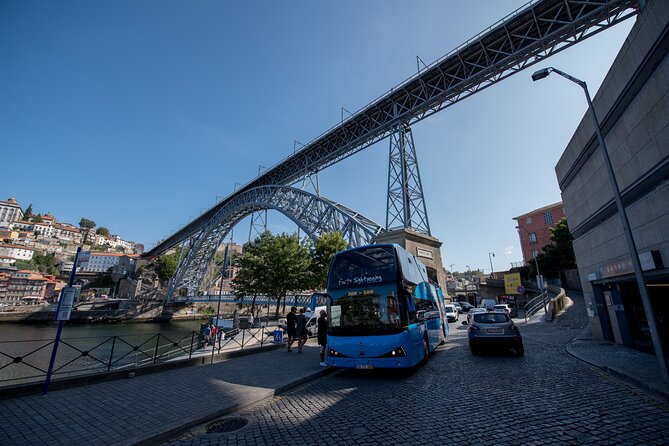 Porto Hop On Hop Off Bus Tour with Wine tasting & Night tour - Comfort and practical tips: audio, stop signs, and crowds