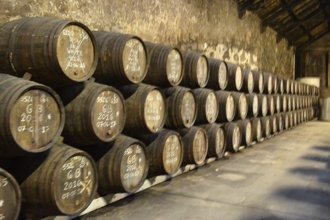 Porto: Port and Douro Wine Walking Tour With 9 Wine Tastings - Stop 3: Fonseca Porto and the cellar experience