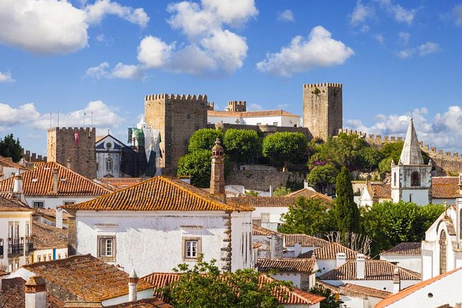 Private Tour Fátima, Nazaré, and Óbidos Day Trip from Lisbon - Stop 4: Óbidos fortified walls, flower pots, and ginja stops