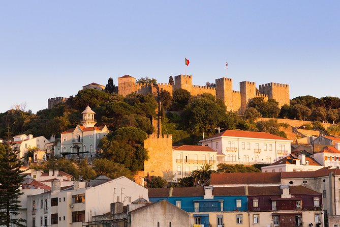 Private Tour: Lisbon Sunset Walking Tour with Fado Show and Dinner - Alfama After Dark: Narrow Streets, Fado Origins, and Moorish Echoes