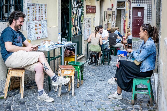 Private Tuktuk Tour with Portuguese Tapas and Wine - Stop 1: Alfama on Foot—Old Streets, Real Neighborhood Energy