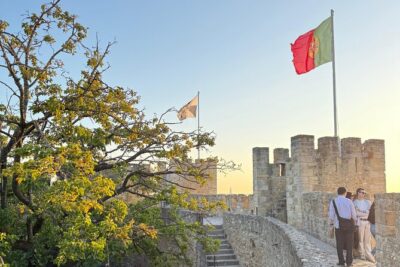 Skip-the-Line Lisbon Tour: S. Jorge's Castle + Old Town Lisbon - Alfama lanes and the ginjinha tasting: where Fado feels close