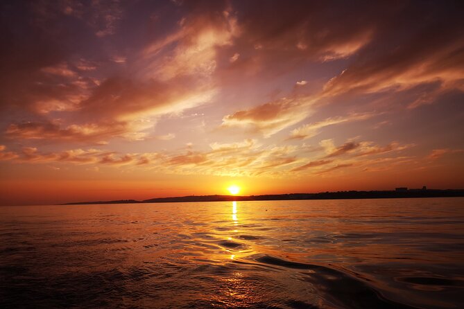 Sunset on a Luxury Sailing Yacht from Vilamoura (Max 12 Guests) - Falésia Beach Stop: Clay Formations Close to Shore