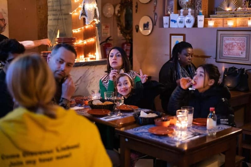 True Taste of Lisbon: Portuguese Tapas, Wine &Surprise Drink - Praça Luís de Camões Start: Finding the Yellow Team Fast