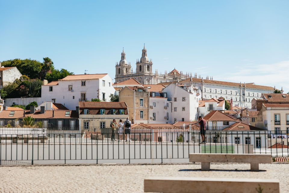 Vadio: Lisbon Old Town Private Tuk Tuk Tour - São Jorge-area views and quick photo windows along the way